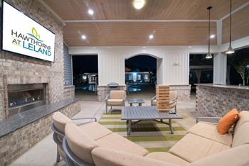 Poolside grilling cabana with fireplace